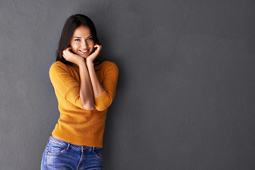 Image showing Fashion, female model and hands in portrait or studio, trendy or cool in gray background. Woman, smile and happy with confidence or pride in mockup space, stylish and edgy in casual outfit or clothes