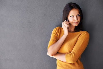 Image showing Woman, portrait and phone call in studio, annoyed and app for communication on gray background. Female person, unhappy and mockup space for conversation, voip and connection for talking or discussion