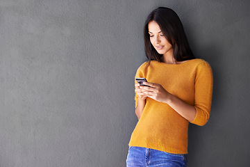 Image showing Phone, app and woman in house with social media, scroll or reading sign up info on wall background. Smartphone, search and female person at home online with google it, competition or giveaway sign up