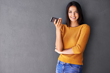 Image showing Woman, phone and wall background for mockup, smile and portrait in fashion for social media. Technology, digital and interent with female person and mobile in studio for online, typing and connection