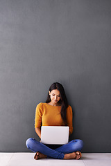 Image showing Research, social media and internet for woman on floor with laptop for online, web and information indoor on weekend. Blogger or content creator and smile with tech for browse and relax with mockup