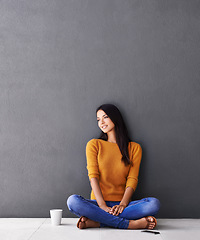 Image showing Woman, thinking and relax or calm in home, peace and cup of coffee on floor of living room. Female person, mockup space and wall background for contemplating, drink and daydreaming in apartment