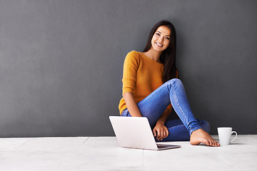 Image showing Woman, laptop and portrait or tea in home, web and cup of caffeine on floor of living room. Female person, mockup space and wall background for freelancer, plan and remote work in apartment on app