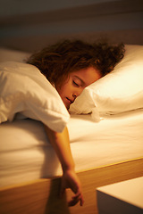Image showing Girl, sleeping and relax in bed at night, comfortable and tired or dream on pillow in home. Female person, child and resting in bedroom or lying for peace, exhausted and fatigue or blanket for calm
