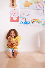 Image showing Portrait, smile and girl hugging teddy bear in bedroom for comfort, love and relax in house. Happiness, child development and face of kid with stuffed animal for playing, cuddle and support in home