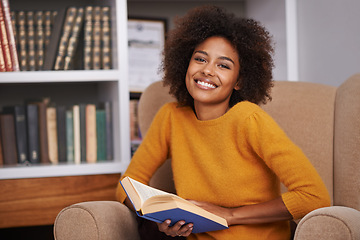 Image showing Woman, portrait and smile with library book for university research project for scholarship, knowledge or learning. Female person, face and reading on college campus, higher education or studying