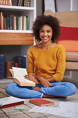 Image showing Portrait, smile and African woman in library, floor and books for education. Textbooks, paper and study material for happy female student with natural afro hair, learning and notes for knowledge