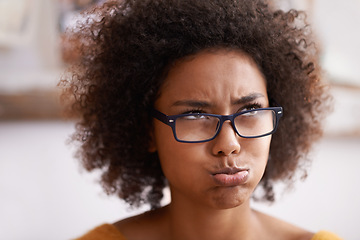 Image showing African woman, pouting and thinking expression on face, confused and doubt in home. Eyewear, planning and problem solving or wondering, frustrated and decision or contemplate on choice or idea