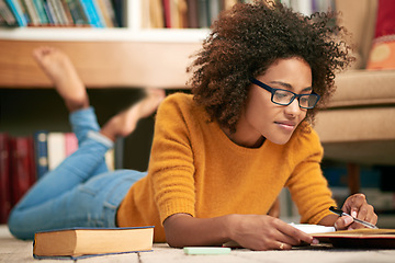 Image showing Woman, student and library research with books or notebook for university project, scholarship or learning. Female person, glasses and floor at college campus for knowledge, literature or studying