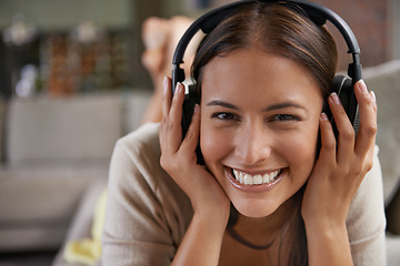 Image showing Music, listening and portrait of happy woman on sofa in home streaming radio, playlist or podcast. Girl, smile and hearing sound from headphones on couch with free audio or relax with rock song