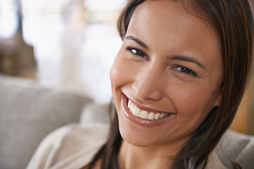 Image showing Woman, portrait and smile in apartment for relax weekend or holiday break for day off, resting or living room. Female person, face and couch in home in Mexico for calm vacation, carefree or peace