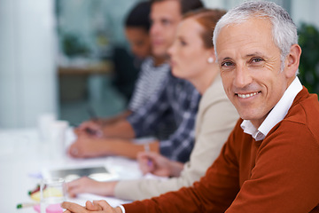 Image showing Mature businessman, portrait and happy for training in seminar and meeting with coworkers in conference room. Accountant, positive or face in professional group or convention for finance or auditing