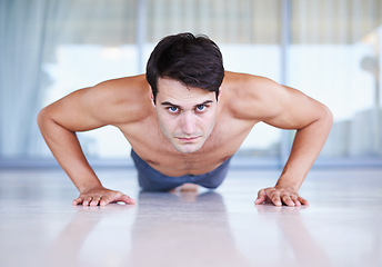 Image showing Man, portrait and push up for fitness, muscle training with body and self care in apartment. Serious athlete, exercise and endurance in workout for health, wellness for sports and challenge at home