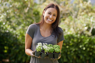 Image showing Portrait, smile and excited woman in a garden with plant, sprout or leaf growth outdoor. Backyard, sustainability and face of female person gardening outside for lawn, grass or asylum seedling soil