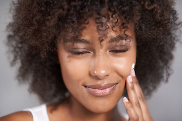 Image showing African woman, beauty and skincare cream with smile, wellness or afro in home bathroom for morning routine. Girl, person and serum with cosmetics, touch or transformation with self care in apartment