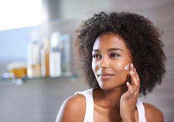 Image showing Black woman, cream on face and skincare in bathroom for beauty at home, morning routine and antiaging treatment. Facial, mask with lotion or sunscreen, cosmetic care and moisturizing for healthy skin