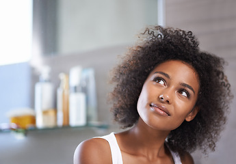 Image showing African woman, bathroom and smile in morning with thinking, reflection and ideas in apartment. Girl, person and happy for memory with beauty, health and vision for insight, wellness and afro in house