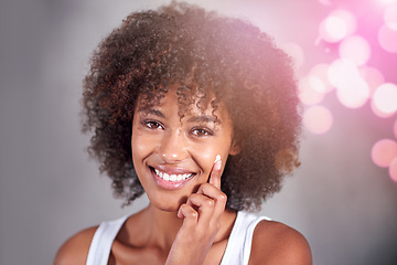 Image showing African woman, portrait and skin cream with smile, wellness and afro in home bathroom to start morning routine. Girl, person and serum with cosmetics, bokeh or transformation with beauty in apartment