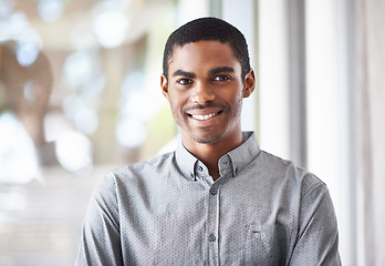 Image showing Happy black man, portrait and window with confidence or ambition for career, job or creative startup at office. Face of African male person or employee with smile for expertise or positive attitude