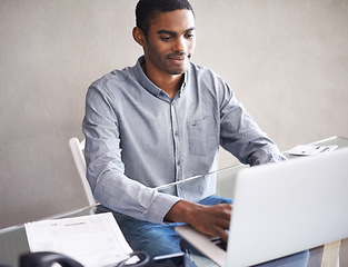 Image showing Home office, typing and black man on laptop for business, remote work and reading email on internet. Pc, computer and professional freelancer at desk for blog, article or copywriting for creativity