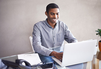 Image showing Laptop, typing and happy black man in home office for business, remote work and reading email online. Pc, computer and professional freelancer at desk for blog, article or copywriting for creativity