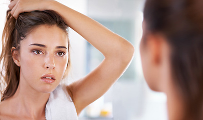 Image showing Woman, mirror and skincare for natural beauty in bathroom for cosmetic facial, treatment or washing. Female person, hand and reflection in home for dermatology glow for heath, self care or wellness