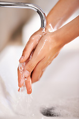 Image showing Cleaning, water and soap on hands of person with skincare, routine and grooming in home closeup. Bathroom, tap and washing skin with foam for protection of hygiene from germs, bacteria and virus