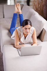 Image showing Laptop, internet and social media with woman on sofa in living room of apartment for research or browsing. Computer, relax and technology with person typing email, report or article for online blog