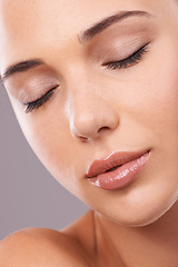 Image showing Woman, studio and thinking with dreaming, cosmetics and gloss for makeup and glamour appeal in face zoom. Female person, eyebrow and micro blading for lipstick, foundation and grey background beauty