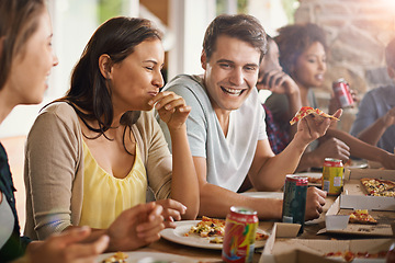 Image showing Friends, laughing and eating of pizza in home with happiness, soda and social gathering for bonding in dining room. Men, women and fast food with funny joke and diversity at table in lounge of house