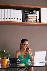 Image showing Phone call, remote work and landline with woman employee in office for communication or reception. Laptop, smile and young business person answering telephone in small business or startup workplace