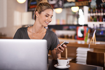 Image showing Woman, reading and phone on social media in cafe and writer with remote work in restaurant. Happy, person and scroll smartphone with news, article or review coffee shop on blog, website or laptop