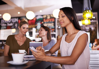 Image showing Woman, reading and phone on social media in cafe and customer relax with latte in restaurant. Happy, person and scroll smartphone online with news, article or review coffee shop on blog website