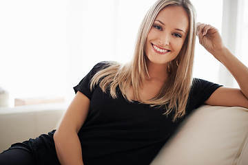 Image showing Happy, portrait and woman on a sofa relax with confidence, positive attitude or leisure in her home. Face, smile and female person in a living room with vacation, free time or resting holiday