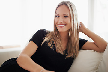 Image showing Portrait, smile and woman on a sofa relax with confidence, positive attitude or feel good mood in her home. Face, happy and female person in a living room with vacation, free time or resting holiday