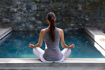 Image showing Back, pool and meditation with woman, yoga and fitness with sunshine and peace with breathing. Rear view, person and water with girl and yogi with wellness and healthy with hobby, relax and exercise