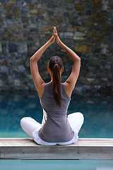 Image showing Back, swimming pool and wellness with woman, yoga and fitness with sunshine and peace with breathing. Rear view, person and water with girl and yogi with meditation and healthy with hobby and relax