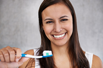 Image showing Happy, woman and portrait with toothbrush in morning, routine and grooming with self care in home. Clean, teeth and girl with healthy smile from whitening, dental toothpaste and brushing in bathroom