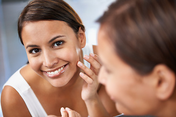 Image showing Portrait, woman and skincare in mirror face cream, moisturizing and cosmetics for beauty. Female person, smile and reflection in bathroom for lotion, self care and glowing skin for daily routine