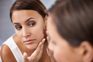 Image showing Pores, woman and skincare in mirror with face spot or pimple or acne on cheek. Female person, pointing and serious with reflection in bathroom for skin and self care as daily routine for treatment