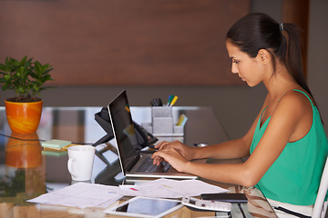 Image showing Business woman, reading and planning on laptop for financial research, email or internet in her office. Young worker or professional accountant with computer for budget report, typing and information