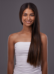 Image showing Hair care, portrait and happy woman with beauty or skincare isolated on gray studio background. Hairstyle, cosmetics and face of Indian model in makeup at salon for glow, shine or body at hairdresser