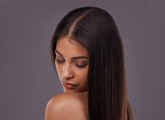 Image showing Beauty, hair and face of woman in on gray background for healthy texture, wellness and hairstyle. Haircare, hairdresser and person with eyes closed for salon products, cosmetics and shine in studio