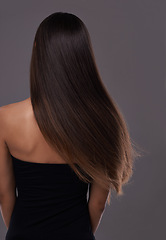 Image showing Hair care, wind and back of woman with beauty, shine or body isolated on a gray studio background. Hairstyle, cosmetics and rear view of model in salon for treatment, growth or hairdresser for glow