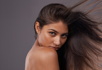 Image showing Portrait, wind and closeup of woman for hair care, treatment and blow dry with mockup space isolated on studio background. Female person, breeze and hairstyle for shampoo, hairdressing and brushing