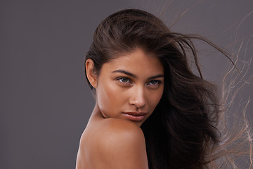 Image showing Wind, blow dry and closeup of woman for hair care, treatment and beauty with mockup space isolated on studio background. Female person, model and hairstyle for shampoo, hairdressing and cosmetology