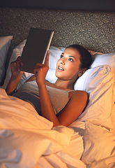 Image showing Night, tablet and ebook for woman with smile in bed, relax and rest on soft mattress in bedroom. Digital, technology and reading for entertainment of female person, girl and adult in apartment