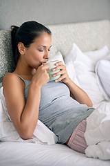 Image showing Woman, drinking coffee and bed for morning caffeine on weekend or relaxing break, day off or leisure. Female person, beverage and linen in apartment with for Sunday holiday or peace, resting or calm