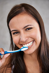 Image showing Brushing teeth, smile and woman for dental with toothpaste, health and wellness for plaque and dentistry for gum care. Young person, happy and portrait for breath and clean for mouth and results