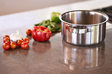 Image showing Kitchen counter, pot and vegetable ingredients to cook for healthy, meal and supper for wellbeing, diet and nutrition. Home, natural and fresh with organic food to prepare for dinner and soup